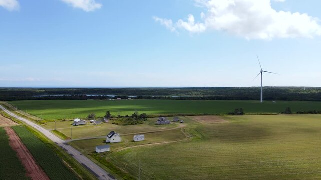 Wind turbines generating renewable green energy in rural landscape, Canada