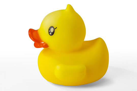 Side view of a classic yellow rubber ducky with orange beak and cute black eye, isolated on white with clipping path