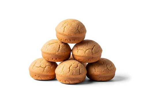 A stacked pile of delicious Colombian bu&ntilde;uelos isolated on a white background, perfect for representing traditional Latin American cheese fried dough snacks.