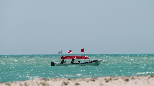 race committee boat monitoring kitesurfing competition at mayapo la guajira sea
