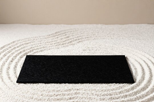A black felt underlay on zen garden gravel