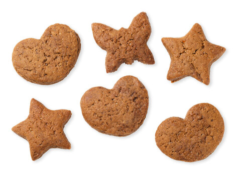 Gingerbread cookies in heart, star and butterfly shapes isolated on white background top view