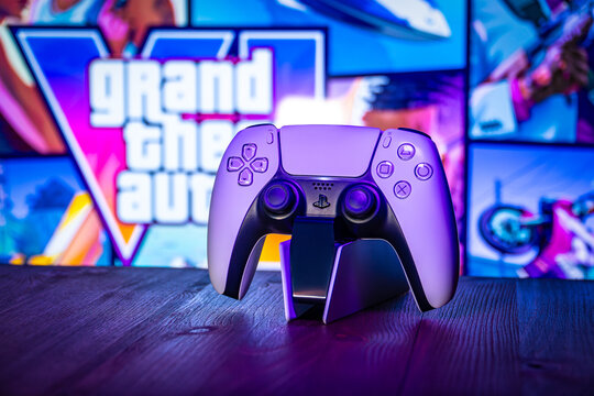 July 11, 2026, Odessa, Ukraine. PS5 DualSense controller on a charging dock with GTA VI logo back