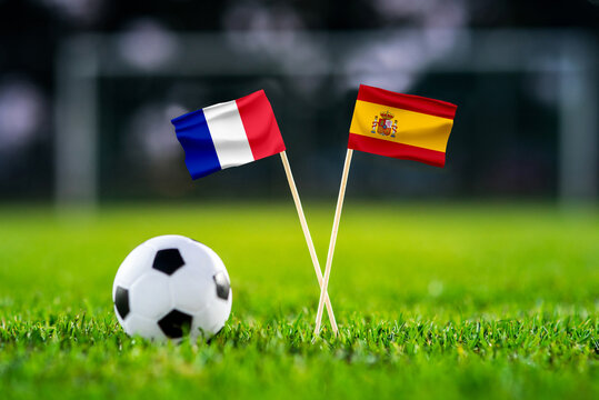 France vs Spain, Semifinals, national flags before international football match, football on green grass with stadium in the background, Arlington, July 14, 2026.