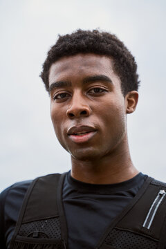 Young Man Training Outdoors in Sports Gear During Cloudy Weather