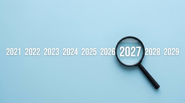 Magnifying glass focused on the year 2027 surrounded by a timeline of years from 2021 to 2029 on a plain light blue background, for future planning