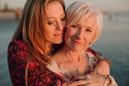 Mother and adult daughter beach portrait