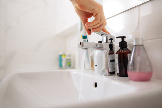 Washing hands in bathroom