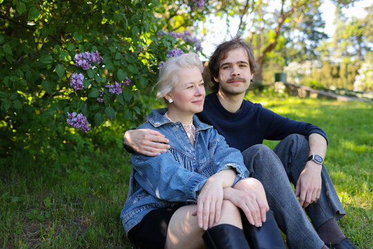 mother with older son walking spending time in the park