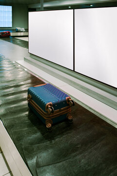 Luggage Waits on the Conveyor Belt at the Airport Baggage Claim Area