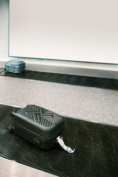 Luggage Sits on a Baggage Claim Belt at an Empty Airport