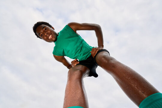 Young Athlete Practicing Running on an Outdoor Track