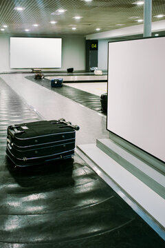 Baggage Claim Area With Suitcases Waiting for Passengers