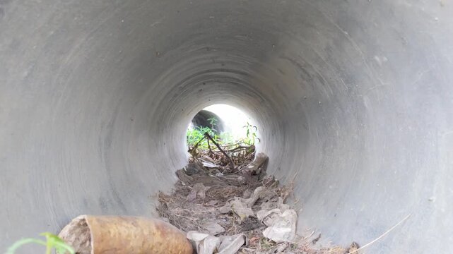 Large circular concrete culvert pipe commonly used for drainage under roads or fields.
