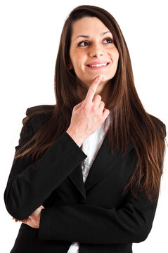 Professional woman in a suit poses with a pondering expression,