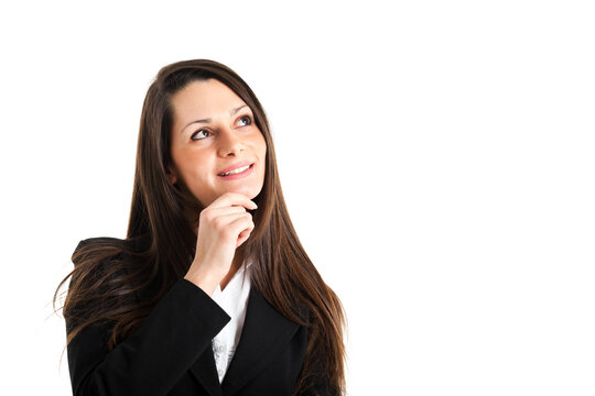 Businesswoman in a suit looks upward, deep in thought