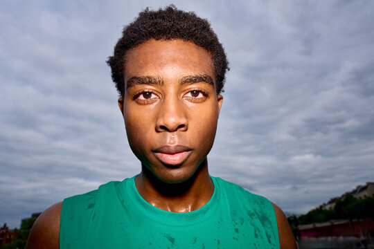 Young Athlete Focuses on Training During Overcast Day in City