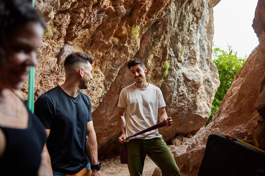 Climbers enjoy time at a rock cave during an outdoor activity