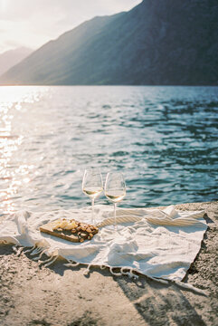white wine with snacks by the sea