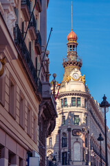 Fototapeta premium Metropolis Building rising above Alcala Street at the corner with Sevilla Street in Madrid Spain