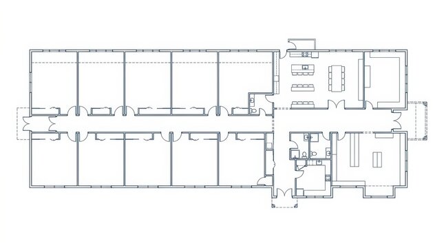 Architectural floor plan of a modern building with multiple rooms and a central hallway