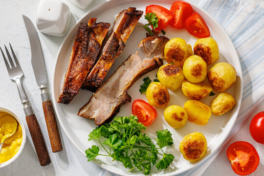 Roasted Pork Ribs with browned baby potatoes