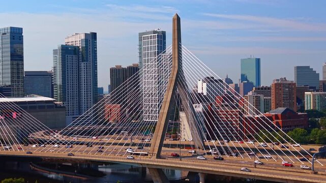 Numerous cars move by the beautiful Leonard P. Zakim Bunker Hill Memorial Bridge across the Charles River. Commuting in Boston, Massachusetts, USA.