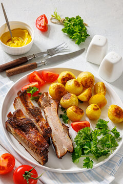 Roasted Pork Ribs with browned baby potatoes