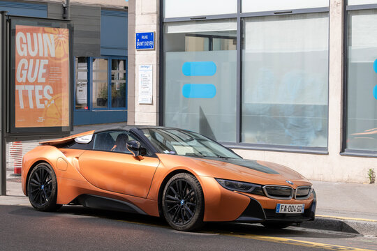 Nancy, France - July 11th 2026 : View on an orange BMW i8 Roadster parked on a street. The BMW i8 was a plug-in hybrid sports car developed by BMW.