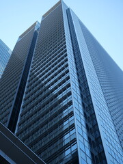 Obraz premium Low angle view of modern skyscrapers in business district, abstract urban architecture background