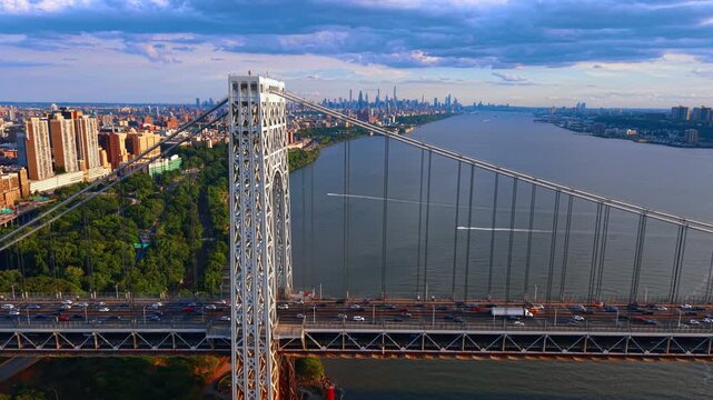 Footage along the George Washington Bridge across the Hudson River. Numerous cars move between the Washington Heights neighborhood in Upper Manhattan, New York City and Fort Lee, New Jersey.