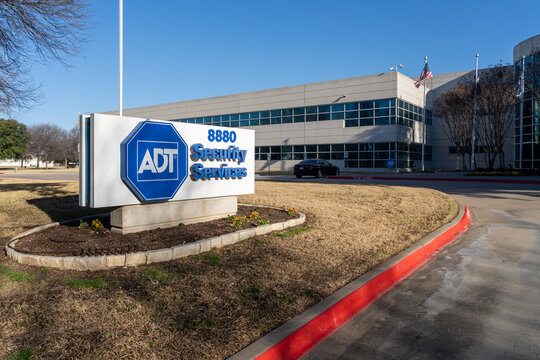 
Irving, Texas, USA - March 20, 2022: ADT Security Services facility on Esters Blvd, Irving, TX, USA. ADT Inc is an American provider of alarm monitoring and home security services. 
