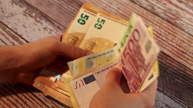counting euro banknotes for personal finance and budgeting