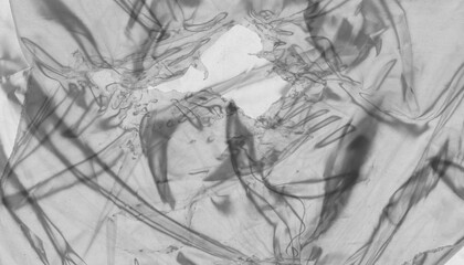 Obraz premium Abstract macro texture of crumpled plastic. Transparent film overlay background. Modern artistic design.