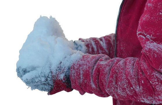 A girl holding snow in her hands on a white background. The girl is wearing a pink jacket.