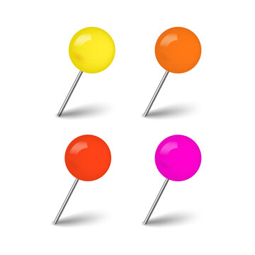 Four colorful round push pins with metallic needles and dark shadows arranged in a grid pattern for office use isolated on a transparent background