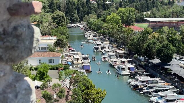 Boats and people canoeing on the Goksu River in Beykoz, Istanbul, Turkey.