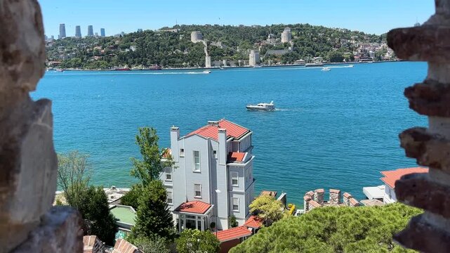 A view showing the historic Anadolu Hisarı fortress and the Bosphorus in Beykoz, Istanbul, Turkey.
