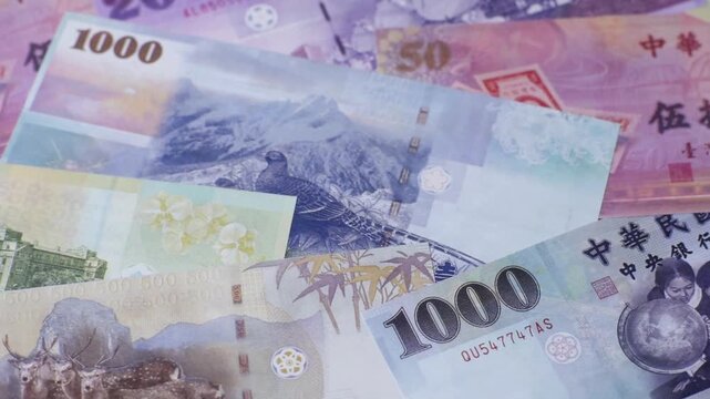 Taiwan, Taiwanese paper banknotes and coins, dollars of various denominations for trade and financial transactions. Taiwanese dollars as a business background for your design