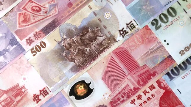 Taiwan, Taiwanese paper banknotes and coins, dollars of various denominations for trade and financial transactions. Taiwanese dollars as a business background for your design