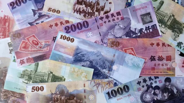 Taiwan, Taiwanese paper banknotes and coins, dollars of various denominations for trade and financial transactions. Taiwanese dollars as a business background for your design