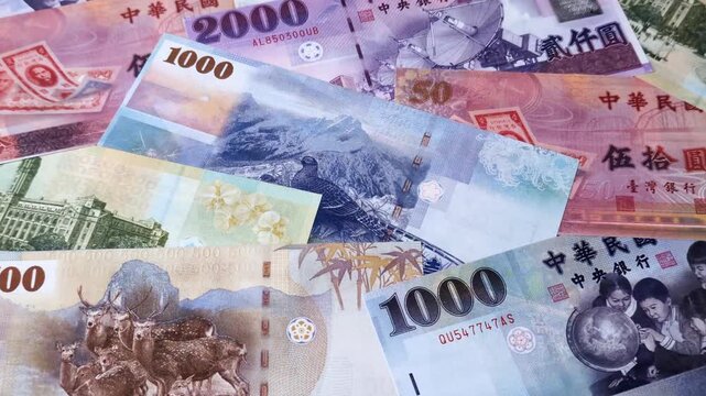 Taiwan, Taiwanese paper banknotes and coins, dollars of various denominations for trade and financial transactions. Taiwanese dollars as a business background for your design
