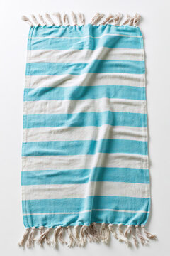 Light Blue and White Striped Turkish Fouta Towel with Fringes on White Background for Beach, Spa, or Home Decor