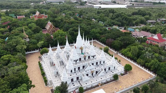 Wat Asokaram. Aerial drone footage of Phra Thutangkha Chedi at Wat Asokaram in Samut Prakan Thailand. Aerial view Thai landmark or travel destination for tourist who seeing Thai architecture culture.