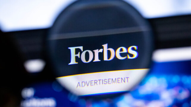 Close-up of Forbes magazine cover. Business publication advertisement. News media logo.
