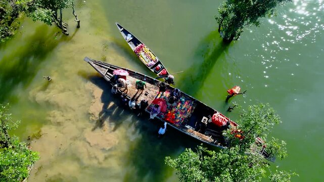 SUNAMGANJ, BANGLADESH - JULY 03, 2026: An aerial drone Video shows isolated wetland villages surrounded by vast water during the monsoon season at Tanguar Haor in Sunamganj, Bangladesh.