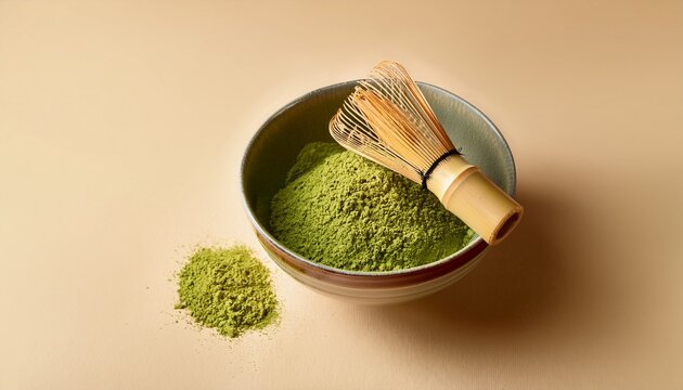 Traditional Matcha Powder In Ceramic Bowl With Bamboo Whisk On Beige Background