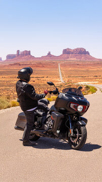 Motorcycle rider monument valley desert highway road Forrest Gump 