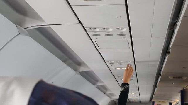Passenger comfort improves when traveler adjusts air vent above seat. Passenger comfort supports relaxing journey, while air vent delivers steady airflow, air vent increases personal comfort.