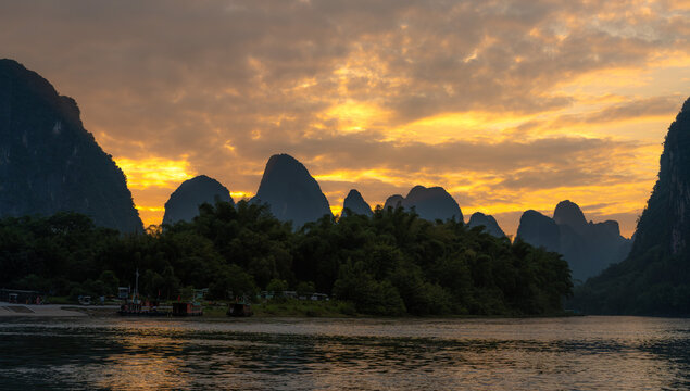 Guilin karst peaks reflected in Li River at sunset